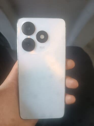 Ağımtıl rəngli, düz kənarlı smartfon. Arxa paneldə kvadrat modula lalafo.az -da Ağımtıl rəngli, düz kənarlı smartfon. Arxa paneldə kvadrat modula