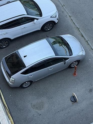 Toyota Prius (2-ci nəsil) hibrid hetçbek - Gümüşü rəng, 5 qapılı lalafo.az -da Toyota Prius (2-ci nəsil) hibrid hetçbek - Gümüşü rəng, 5 qapılı