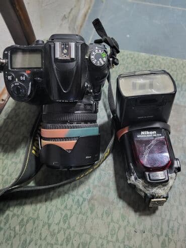 Nikon d7000 aparat yaxsi vexiyyetde ustunde spickasi sb 910 du ustada lalafo.az -da Nikon d7000 aparat yaxsi vexiyyetde ustunde spickasi sb 910 du ustada