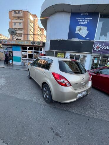 Nissan Tiida, qızılı/bej rəng, hetçbek gövdə. Texniki və dizayn lalafo.az -da Nissan Tiida, qızılı/bej rəng, hetçbek gövdə. Texniki və dizayn