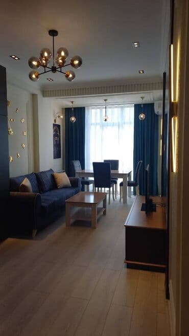 Ayna Sultanova heykəlinin yanında 11 mərtəbəli Yeni tikili binanın lalafo.az -da Ayna Sultanova heykəlinin yanında 11 mərtəbəli Yeni tikili binanın