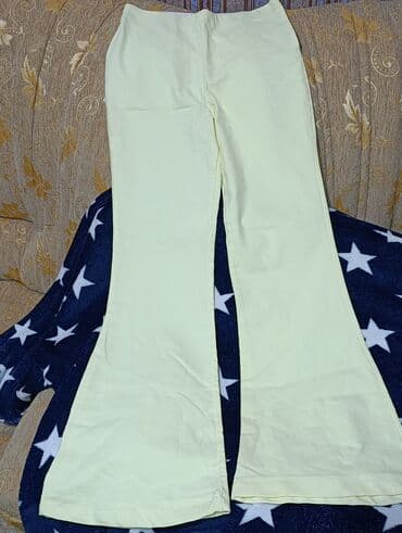 Açıq sarı rəngli qadın şalvarı – aşağıdan genişlənən (flared) model lalafo.az -da Açıq sarı rəngli qadın şalvarı – aşağıdan genişlənən (flared) model