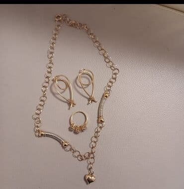 Qızılı tonlarda zərgərlik dəsti - Tərkib: boyunbağı, sırğa cütü və lalafo.az -da Qızılı tonlarda zərgərlik dəsti - Tərkib: boyunbağı, sırğa cütü və