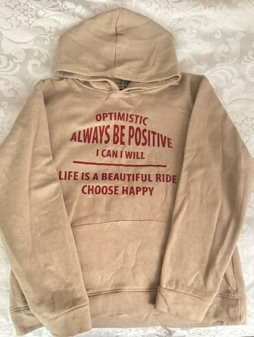 Bej rəngli kapüşonlu svitşört - Üzərində qırmızı yazılar: “OPTIMISTIC lalafo.az -da Bej rəngli kapüşonlu svitşört - Üzərində qırmızı yazılar: “OPTIMISTIC