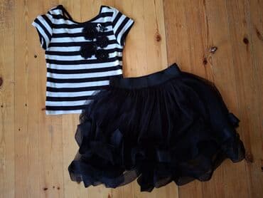 Zolaqlı qara və ağ rəngli qısaqol köynək və qara tül ətəkdən ibarət lalafo.az -da Zolaqlı qara və ağ rəngli qısaqol köynək və qara tül ətəkdən ibarət