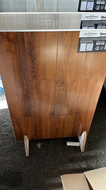 Laminat döşəmə panelləri – taxta teksturalı, isti qəhvəyi tonlarda - lalafo.az -da Laminat döşəmə panelləri – taxta teksturalı, isti qəhvəyi tonlarda -