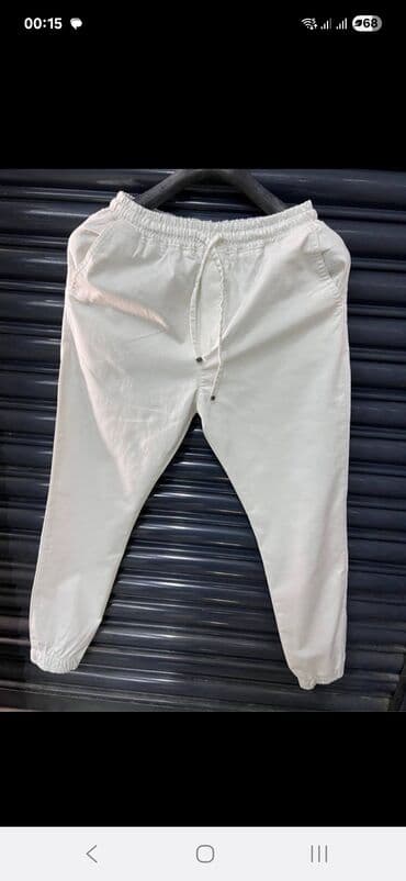 Ağ rəngdə, elastik bel hissəli və bağcıqlı kişi şalvarı. Yanlarda lalafo.az -da Ağ rəngdə, elastik bel hissəli və bağcıqlı kişi şalvarı. Yanlarda