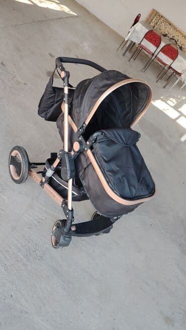 Uşaq arabası – 3 təkərli, çevik şassi, qızılı-şampan rəngli metal lalafo.az -da Uşaq arabası – 3 təkərli, çevik şassi, qızılı-şampan rəngli metal