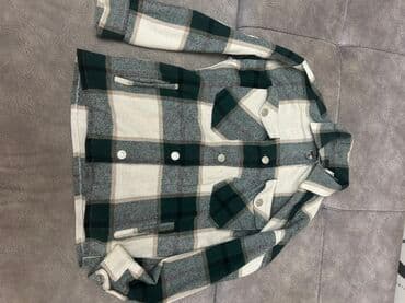 Yaşıl, boz və ağ rənglərdə damalı naxışlı, uzunqol köynək. Düyməli lalafo.az -da Yaşıl, boz və ağ rənglərdə damalı naxışlı, uzunqol köynək. Düyməli