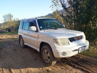 Mitsubishi Pajero iO 5 qapı SUV - Kuzov: ağ rəng, 5 qapı, arxa qapıda lalafo.az -da Mitsubishi Pajero iO 5 qapı SUV - Kuzov: ağ rəng, 5 qapı, arxa qapıda
