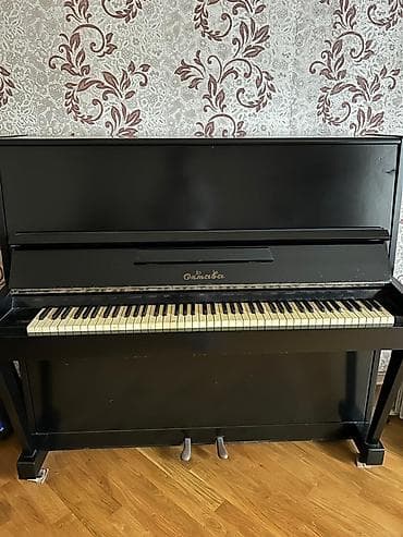 Odessa markalı qara rəngli dik pianino. Bu pianino klassik dizaynı ilə at lalafo.az Odessa markalı qara rəngli dik pianino. Bu pianino klassik dizaynı ilə