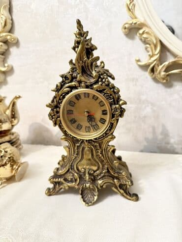 Klassik üslubda bəzədilmiş vintage masaüstü saat. - Material: tökmə lalafo.az -da Klassik üslubda bəzədilmiş vintage masaüstü saat. - Material: tökmə