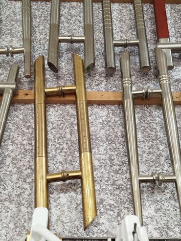 Paslanmayan poladdan və mis/bronz rəngli metaldan ikiqat qapı lalafo.az -da Paslanmayan poladdan və mis/bronz rəngli metaldan ikiqat qapı