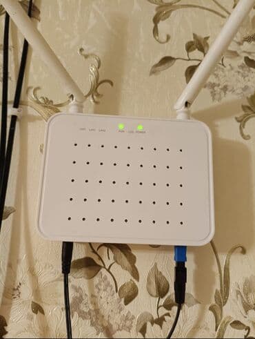 İki antenli Wi‑Fi router/GPON ONT - Rəng: ağ, divara quraşdırıla lalafo.az -da İki antenli Wi‑Fi router/GPON ONT - Rəng: ağ, divara quraşdırıla