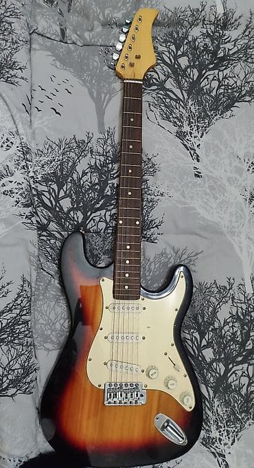 Elektrik gitara – Stratocaster tərzi, sunburst (3-tone) rəng lalafo.az -da Elektrik gitara – Stratocaster tərzi, sunburst (3-tone) rəng