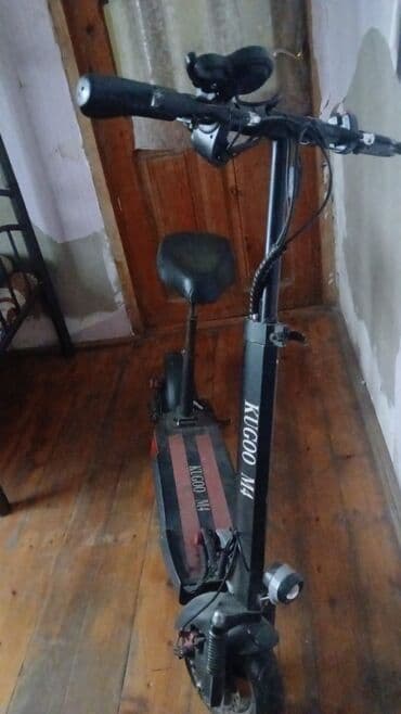 KUGOO M4 elektrik skuteri - Rəng: qara - Model üzərində “KUGOO M4” lalafo.az -da KUGOO M4 elektrik skuteri - Rəng: qara - Model üzərində “KUGOO M4”