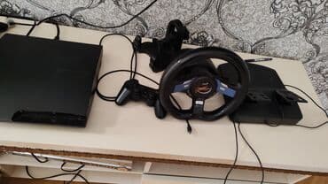 PS3 oyun paketi – PlayStation 3 Slim konsolu + yarış sükanı və lalafo.az -da PS3 oyun paketi – PlayStation 3 Slim konsolu + yarış sükanı və