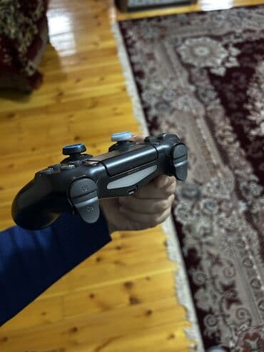 Məhsul: Sony DualShock 4 (PS4) simsiz oyun pultu – qara Təsvir: - lalafo.az -da Məhsul: Sony DualShock 4 (PS4) simsiz oyun pultu – qara Təsvir: -