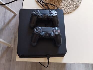 PlayStation 4 Slim oyun konsolu + 2 ədəd DualShock 4 idarəetmə pultu lalafo.az -da PlayStation 4 Slim oyun konsolu + 2 ədəd DualShock 4 idarəetmə pultu