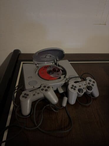 Sony PlayStation (PS1) oyun konsolu dəsti - Model: Original Sony lalafo.az -da Sony PlayStation (PS1) oyun konsolu dəsti - Model: Original Sony