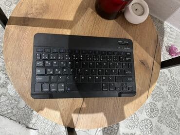 Portativ qara rəngli simsiz klaviatura Bluetooth bağlantısı ilə lalafo.az -da Portativ qara rəngli simsiz klaviatura Bluetooth bağlantısı ilə