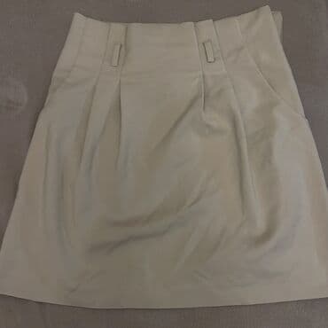 Bej rəngli qısa ətək. - Klassik A-kəsimli dizayn - Ön hissədə plisəli lalafo.az -da Bej rəngli qısa ətək. - Klassik A-kəsimli dizayn - Ön hissədə plisəli