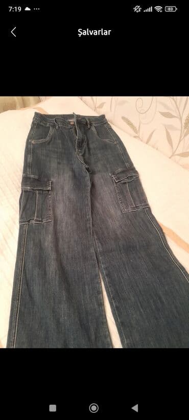 Geniş kəsimli, tünd-mavi rəngdə denim şalvar. Klassik beşcibli dizayn lalafo.az -da Geniş kəsimli, tünd-mavi rəngdə denim şalvar. Klassik beşcibli dizayn