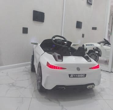 Uşaqlar üçün nəzərdə tutulmuş ağ rəngdə elektrikli avtomobil, uzaqdan lalafo.az -da Uşaqlar üçün nəzərdə tutulmuş ağ rəngdə elektrikli avtomobil, uzaqdan