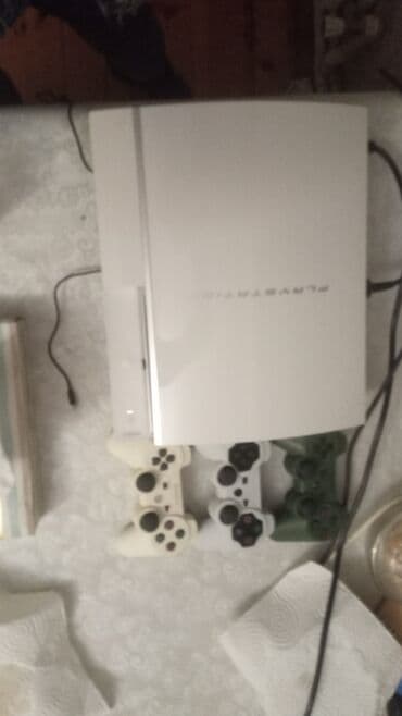PlayStation 3 (ağ rəng) + 3 ədəd DualShock 3 pultu və Hopmann lalafo.az -da PlayStation 3 (ağ rəng) + 3 ədəd DualShock 3 pultu və Hopmann