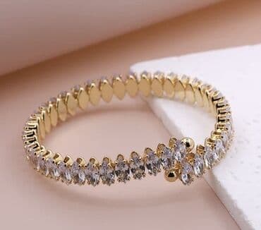 Zərif qadın bilərziyi – qızılı tonlu metal baza üzərində iri parlaq lalafo.az -da Zərif qadın bilərziyi – qızılı tonlu metal baza üzərində iri parlaq