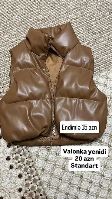 Qəhvəyi rəngdə qadın üçün qolsuz şişmə jilet. - Material: valonka lalafo.az -da Qəhvəyi rəngdə qadın üçün qolsuz şişmə jilet. - Material: valonka