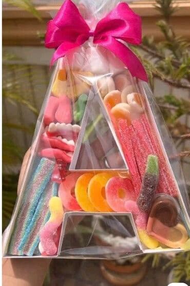 Şəffaf qablaşdırmada müxtəlif növ şirniyyatlarla dolu, "A" hərfi lalafo.az -da Şəffaf qablaşdırmada müxtəlif növ şirniyyatlarla dolu, "A" hərfi