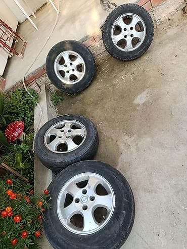 Opel orijinal yüngül lehimli disklər + şinlər komplekti - Sayı: 4 lalafo.az -da Opel orijinal yüngül lehimli disklər + şinlər komplekti - Sayı: 4