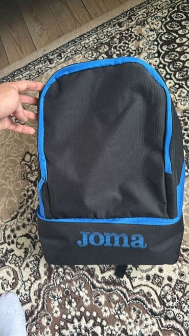Joma brendli idman/rüksak çantası - Rəng: qara, mavi detallar və Joma lalafo.az -da Joma brendli idman/rüksak çantası - Rəng: qara, mavi detallar və Joma