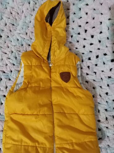 Uşaq üçün kapüşonlu puffi jilet - Rəng: parlaq sarı - Model lalafo.az -da Uşaq üçün kapüşonlu puffi jilet - Rəng: parlaq sarı - Model
