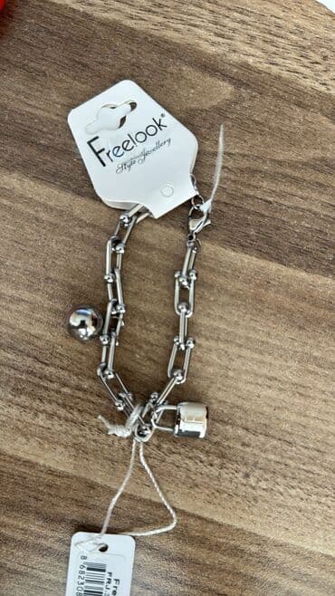 Frelook brendindən gümüşü rəngli qolbaq. Zəncirvari dizaynı və parlaq lalafo.az -da Frelook brendindən gümüşü rəngli qolbaq. Zəncirvari dizaynı və parlaq