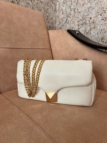 Ag suni deri canta genisdir lalafo.az -da Ag suni deri canta genisdir