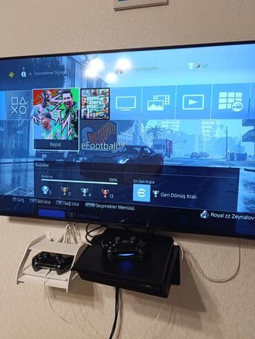 PlayStation 4 oyun konsolu dəsti - PS4 konsolu (qara), TV-yə qoşulu lalafo.az -da PlayStation 4 oyun konsolu dəsti - PS4 konsolu (qara), TV-yə qoşulu